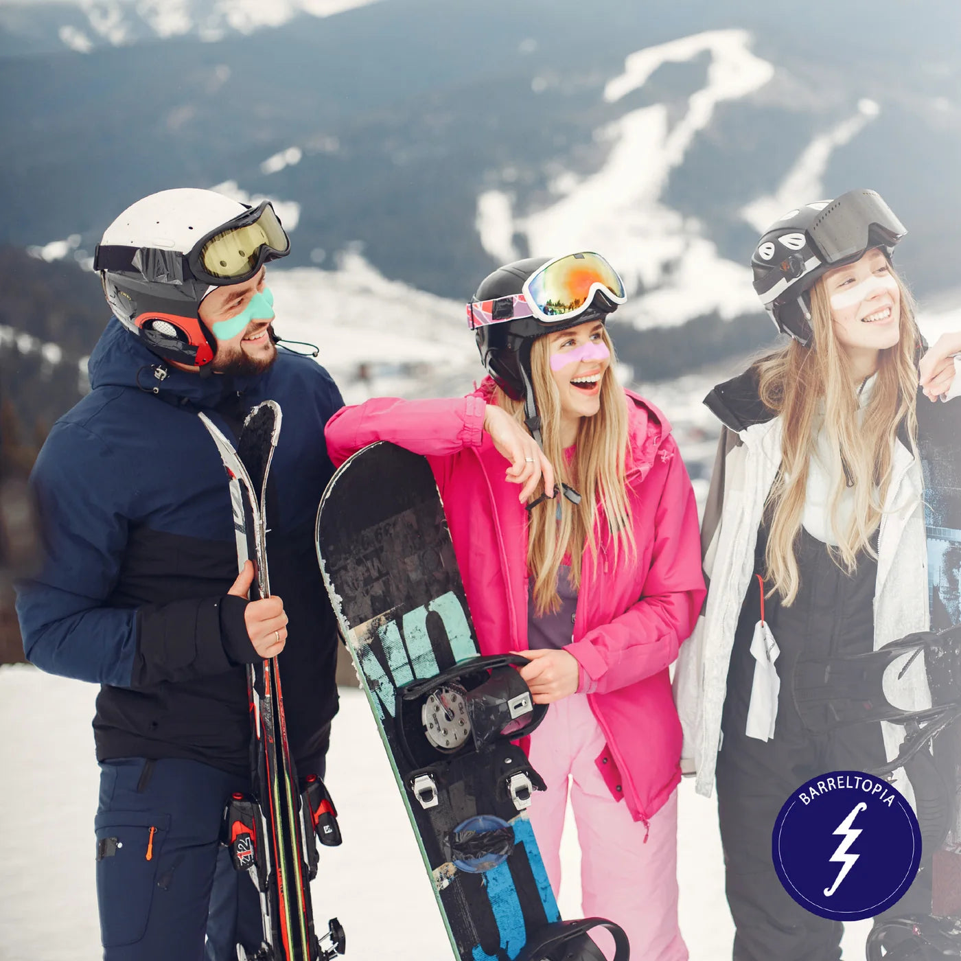 Friends with skis and snowboards on the slopes